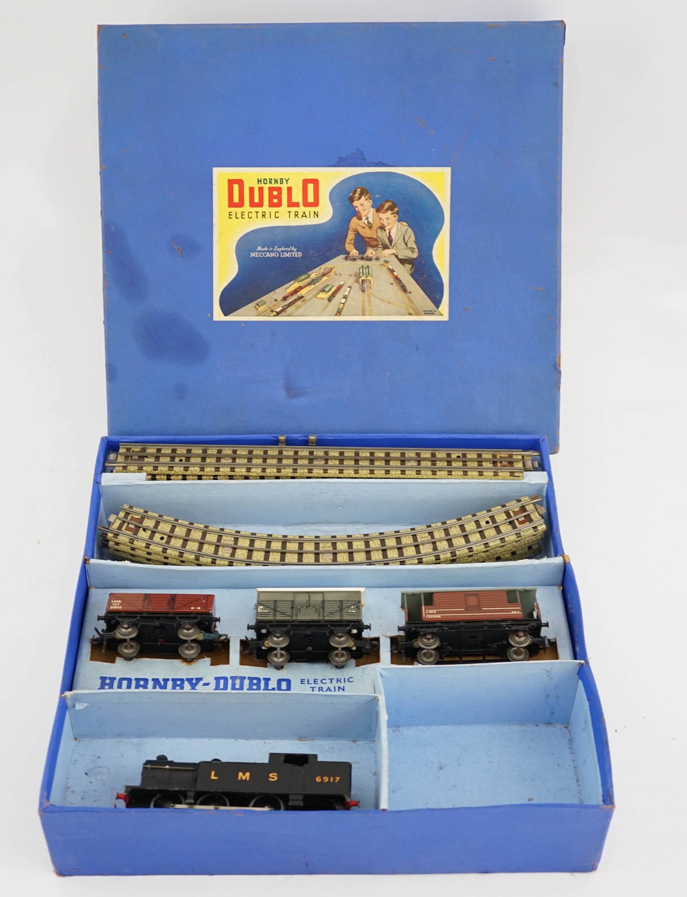 A collection of Hornby Dublo railway for 3-rail running, including; a boxed EDG7 Tank Goods Train set comprising an LMS Class N2 0-6-2 locomotive, 6917, freight wagons and track sections